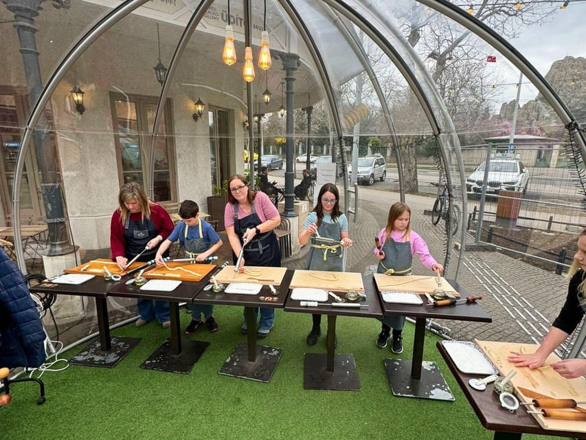 Budapest: Chimney Cake Workshop in City Park - Shaping the dough, one small cake at a time