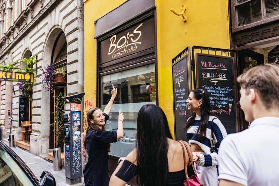 Budapest: Guided Foodie Walking Tour with Food and Drinks - Walking through District 7’s old Jewish quarter