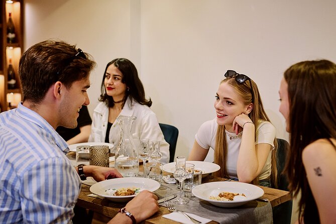 Central Budapest Food Walking Tour with Drinks Included - Hearty Hungarian mains at the table